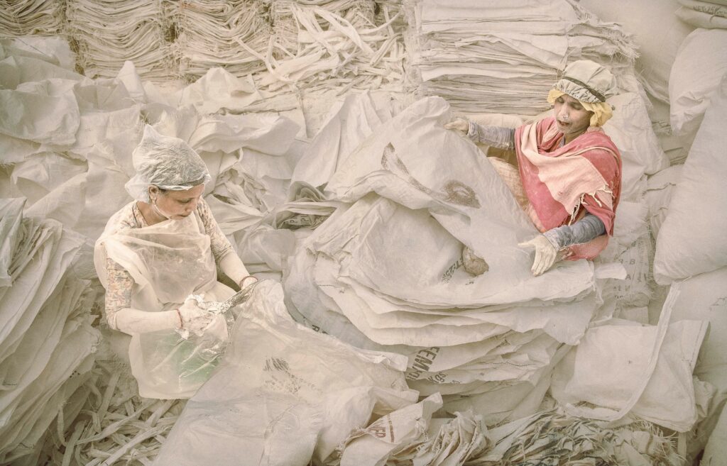 The ghostly figures foreshadow the risks for these women working in such conditions.