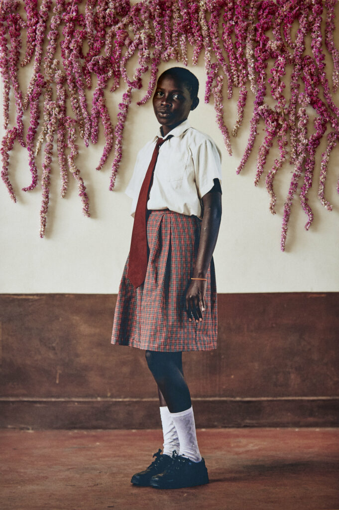 12-year-old Michealle Naeku gazes directly into the camera with confidence.