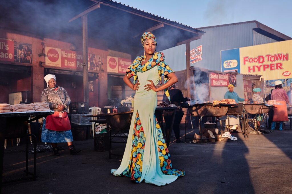 Belinda Qaqamba Ka-Fassie, a drag artist and activist, poses at a Shisanyama—a community space where women cook and sell meat—in Khayelitsha, a township located on the Cape Flats, near Cape Town, South Africa.